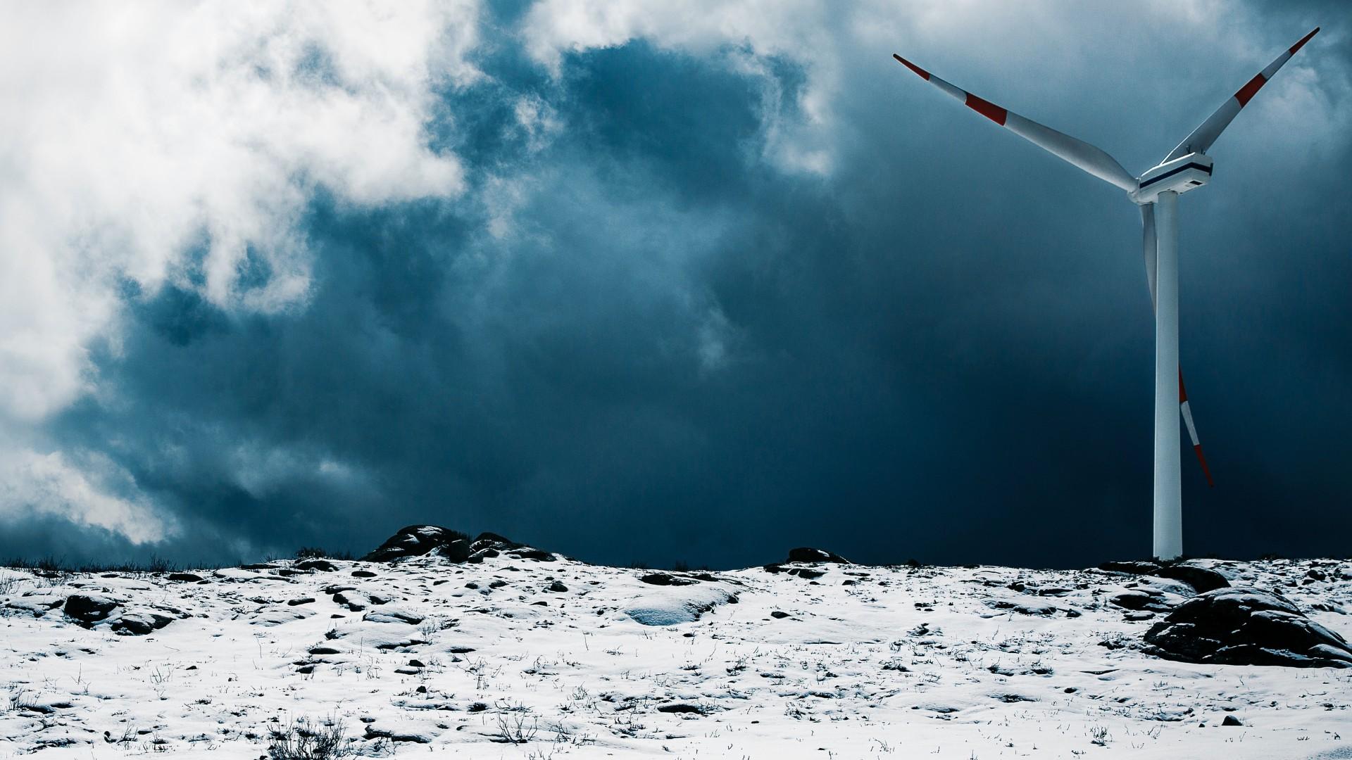 Wind turbine on a snow-covered mountain