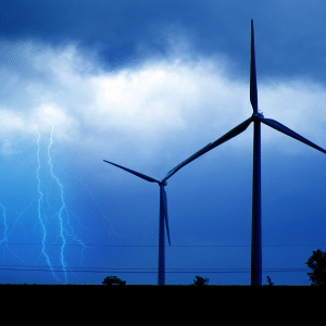 Thunderstorm with lightning strike and wind turbines.